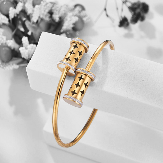 Bracelet jonc doré avec motifs étoiles et cylindres pavés